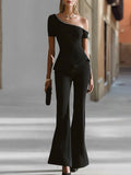 Cristina | Completo pantaloni nero con top a spalla singola e peplo