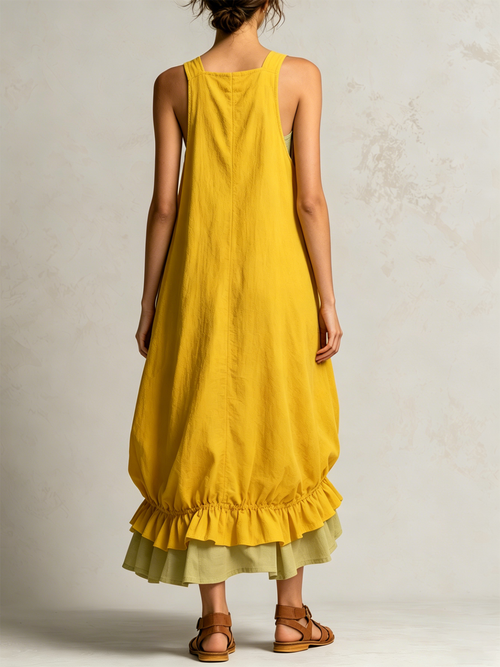 Amparo | Vestido midi tipo overall amarillo sin mangas con bolsillos cargo y dobladillo de volantes en capas