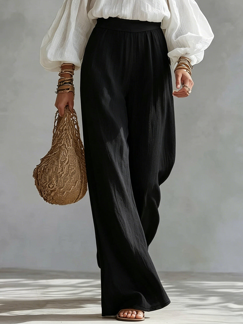 Andrea | Conjunto con top blanco de hombros descubiertos y pantalones negros palazzo