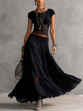 Ginevra | Set composto da top trasparente con pannelli in pizzo nero e gonna maxi plissettata